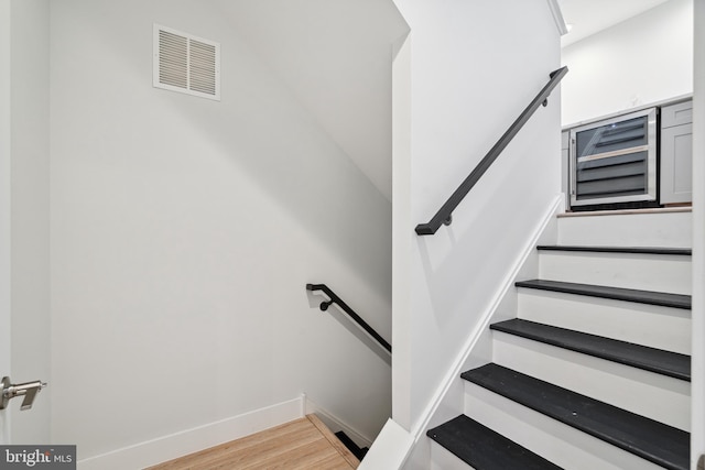 1448 N Myrtlewood St, Philadelphia, PA 19121 - stairs featuring wood finished floors and baseboards