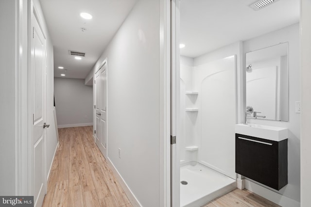 1448 N Myrtlewood St, Philadelphia, PA 19121 - bathroom with vanity, a stall shower, wood finished floors, and recessed lighting