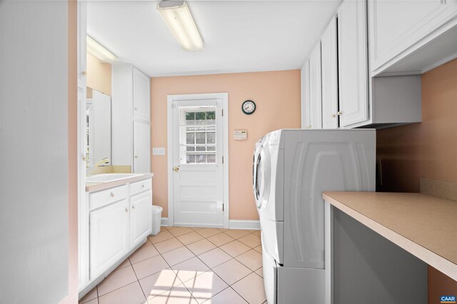 2865 Proffit Rd, Charlottesville, VA 22911 - washroom with light tile patterned floors, cabinet space, and washer / clothes dryer
