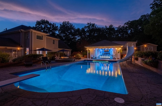 2865 Proffit Rd, Charlottesville, VA 22911 - outdoor pool featuring a water slide, a patio area, an outbuilding, an outdoor hot tub, and a storage structure