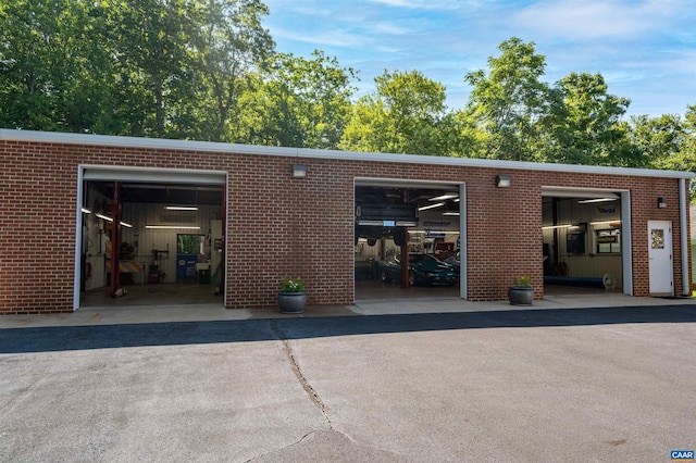 2865 Proffit Rd, Charlottesville, VA 22911 - rear view of property featuring a garage and brick siding