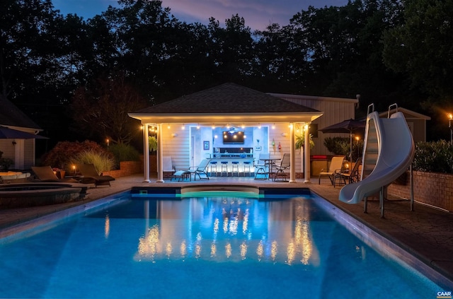 2865 Proffit Rd, Charlottesville, VA 22911 - view of pool featuring a water slide, a patio, and an outdoor structure