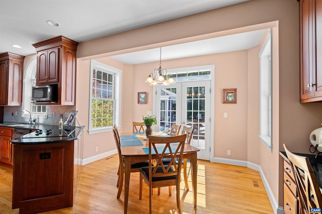2865 Proffit Rd, Charlottesville, VA 22911 - dining space featuring light wood-style flooring, a chandelier, and recessed lighting