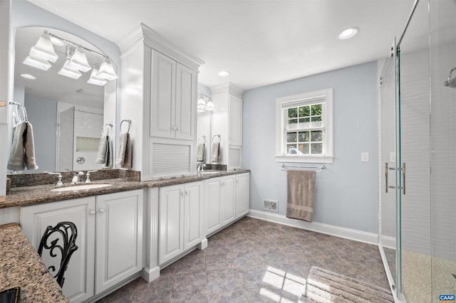 2865 Proffit Rd, Charlottesville, VA 22911 - bathroom featuring double vanity, a stall shower, and recessed lighting