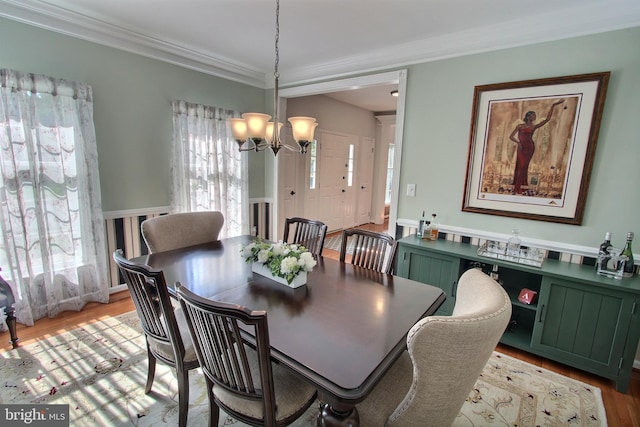 8011 Lions Crest Way, Gaithersburg, MD 20879 - dining space with a chandelier, light wood-type flooring, and ornamental molding
