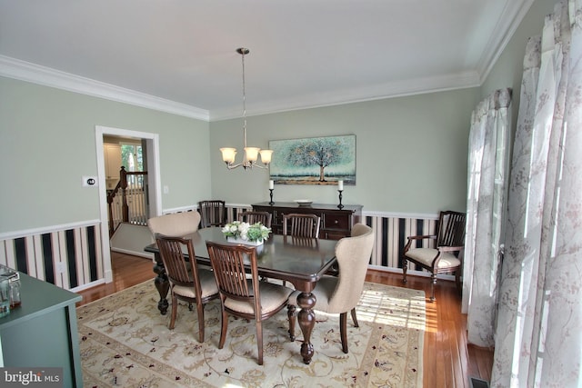 8011 Lions Crest Way, Gaithersburg, MD 20879 - dining room featuring crown molding, a chandelier, and wood finished floors