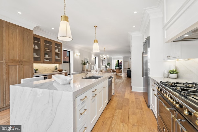 1720 15th St NW, Washington, DC 20009 - kitchen featuring premium range hood, open floor plan, stainless steel dishwasher, a center island with sink, and crown molding