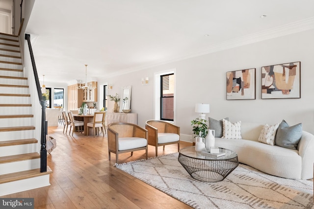 1720 15th St NW, Washington, DC 20009 - living area featuring stairway, a chandelier, crown molding, and wood-type flooring