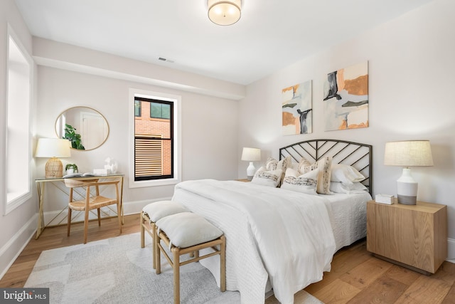 1720 15th St NW, Washington, DC 20009 - bedroom featuring multiple windows and wood finished floors