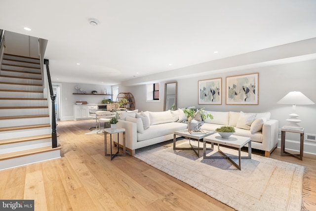 1720 15th St NW, Washington, DC 20009 - living room with stairway, light wood-style floors, and recessed lighting