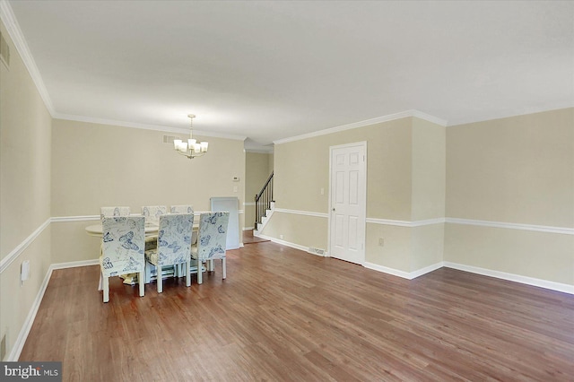 38 Fairfax Vlg, Harrisburg, PA 17112 - dining space with a chandelier, wood finished floors, stairway, and crown molding