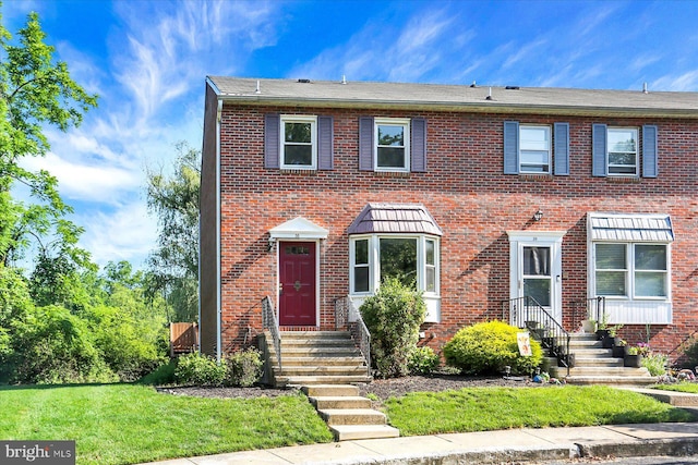 38 Fairfax Vlg, Harrisburg, PA 17112 - townhome / multi-family property featuring brick siding and a front yard