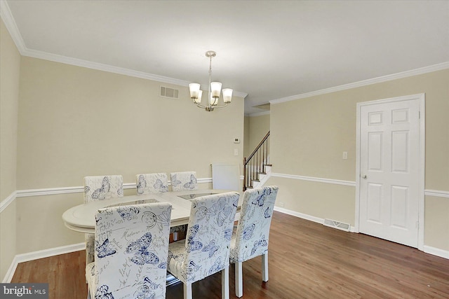 38 Fairfax Vlg, Harrisburg, PA 17112 - dining room with a chandelier, wood finished floors, crown molding, and stairway