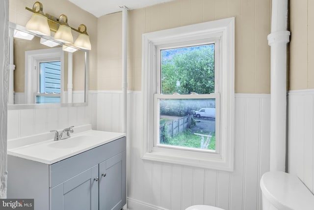 204 S Sherman St, York, PA 17403 - bathroom with vanity, a decorative wall, and a wainscoted wall