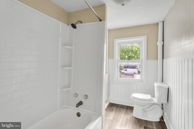 204 S Sherman St, York, PA 17403 - full bathroom with wood finished floors, shower / tub combination, and a wainscoted wall