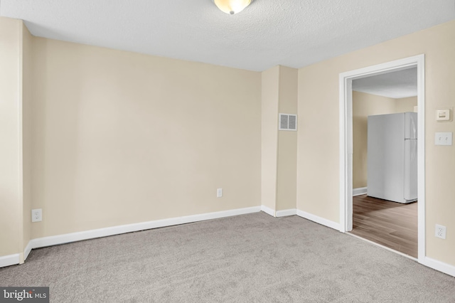 204 S Sherman St, York, PA 17403 - carpeted empty room featuring baseboards and a textured ceiling