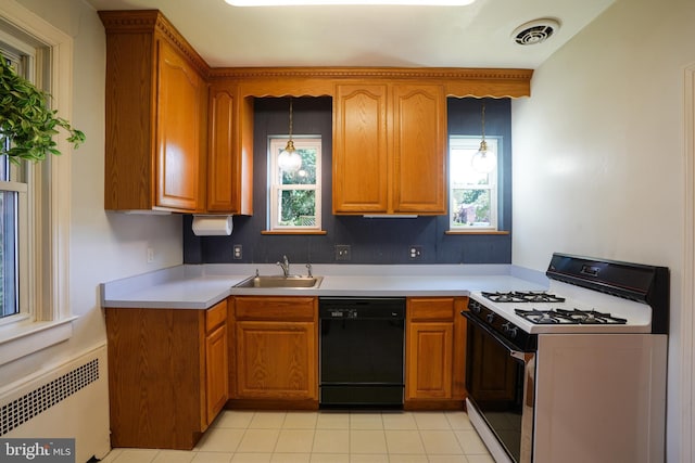 6339 Frederick Rd, Baltimore, MD 21228 - kitchen with dishwasher, white gas stove, radiator heating unit, brown cabinets, and healthy amount of natural light