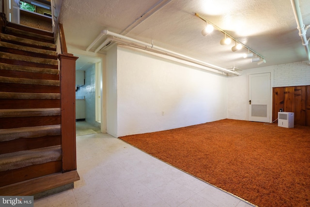 6339 Frederick Rd, Baltimore, MD 21228 - basement featuring stairs and a textured ceiling