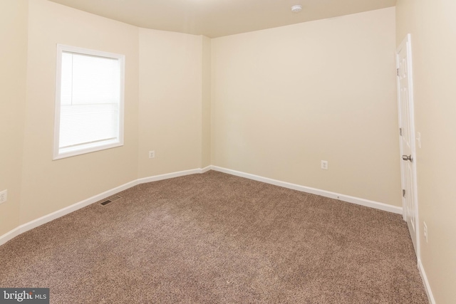 3923 Fairview Ave, Baltimore, MD 21216 - carpeted empty room with baseboards and a smoke detector