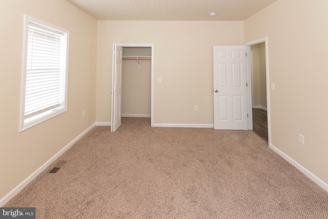 3923 Fairview Ave, Baltimore, MD 21216 - unfurnished bedroom featuring light carpet and baseboards