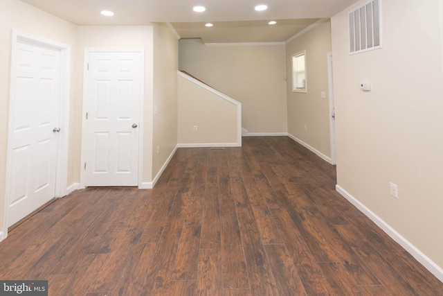3923 Fairview Ave, Baltimore, MD 21216 - basement featuring recessed lighting, crown molding, dark wood finished floors, and stairway