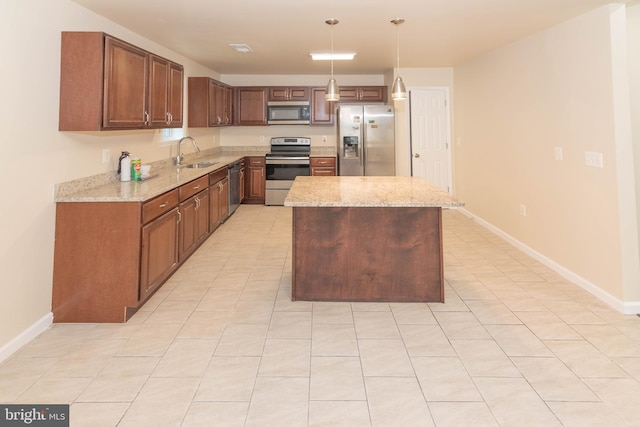 3923 Fairview Ave, Baltimore, MD 21216 - kitchen featuring stainless steel appliances, light stone countertops, decorative light fixtures, a center island, and light tile patterned floors