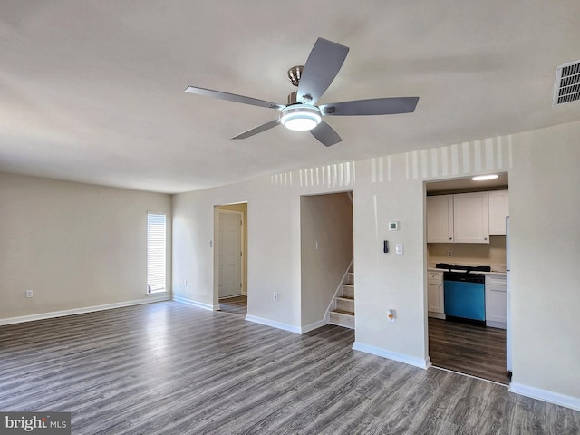 8688 Village Sq, Alexandria, VA 22309 - unfurnished living room with wood finished floors, ceiling fan, and stairway