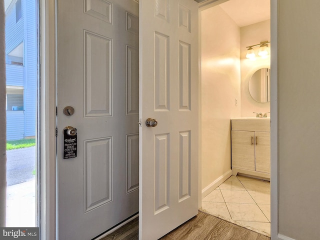 8688 Village Sq, Alexandria, VA 22309 - bathroom featuring vanity and baseboards