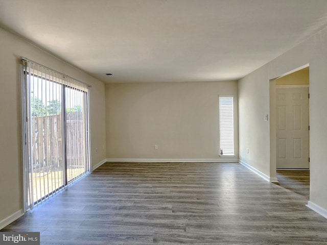 8688 Village Sq, Alexandria, VA 22309 - spare room with plenty of natural light and dark wood-style floors