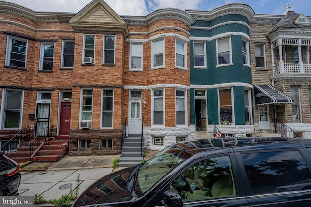 2812 Auchentoroly Ter, Baltimore, MD 21217 - townhome / multi-family property featuring entry steps, brick siding, and cooling unit