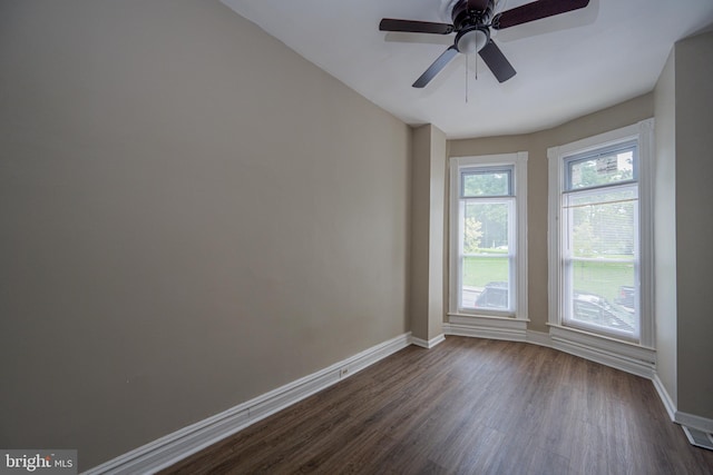 2812 Auchentoroly Ter, Baltimore, MD 21217 - empty room with dark wood finished floors and a ceiling fan