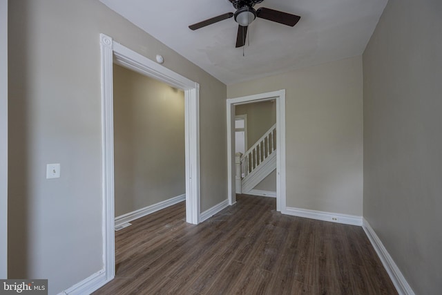 2812 Auchentoroly Ter, Baltimore, MD 21217 - empty room featuring dark wood finished floors, a ceiling fan, and stairway