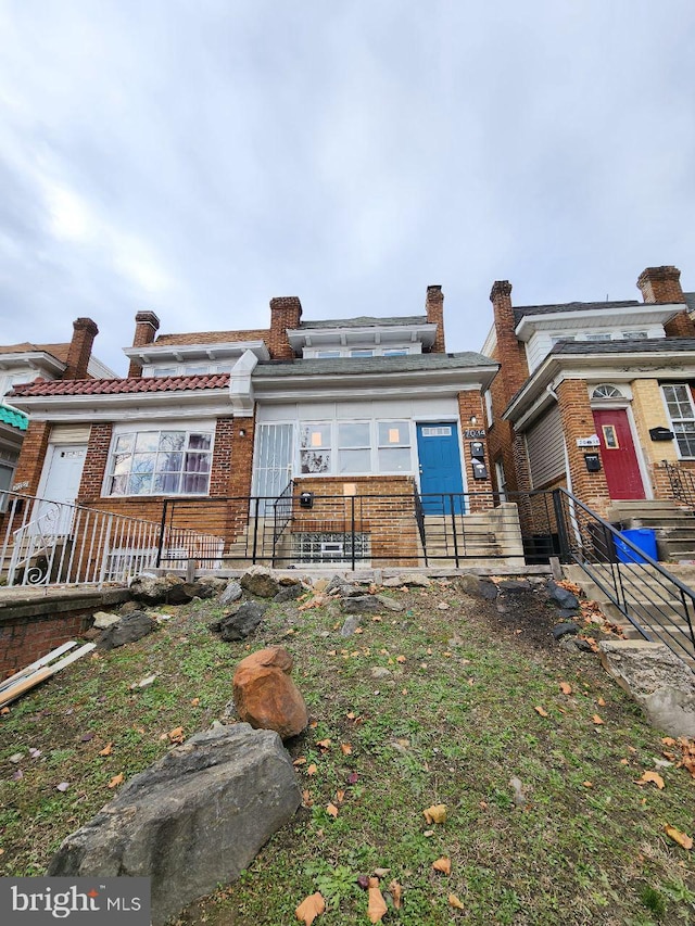 7034 N Broad St, Philadelphia, PA 19126 - back of property with a fenced front yard and brick siding