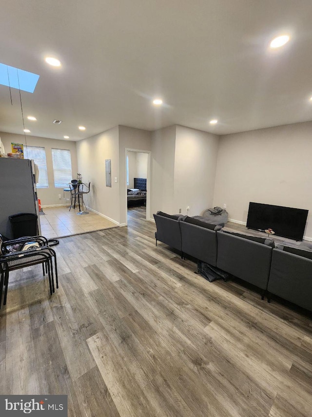 7034 N Broad St, Philadelphia, PA 19126 - living area with recessed lighting, wood finished floors, and a skylight