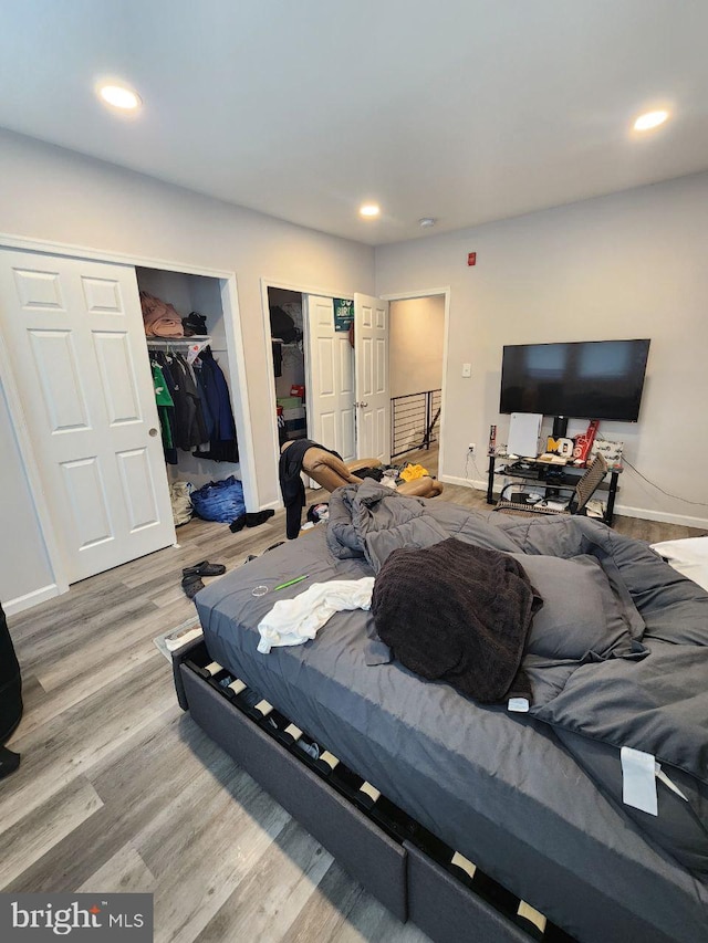 7034 N Broad St, Philadelphia, PA 19126 - bedroom with two closets, wood finished floors, and recessed lighting