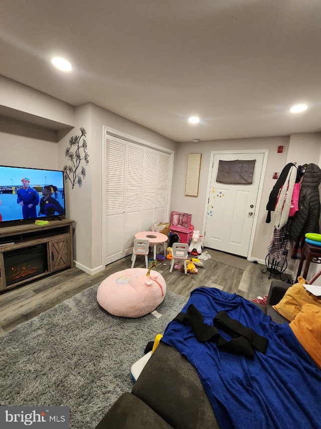 7034 N Broad St, Philadelphia, PA 19126 - living room with wood finished floors, recessed lighting, and a glass covered fireplace