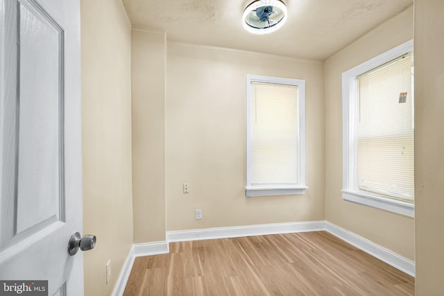 409 N Franklin St, Wilmington, DE 19805 - spare room with light wood-style floors and crown molding