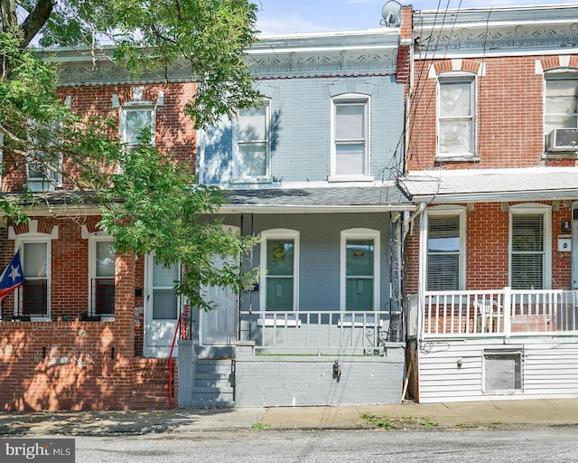 409 N Franklin St, Wilmington, DE 19805 - multi unit property with brick siding, a porch, and cooling unit