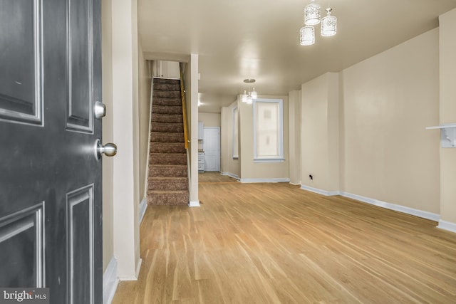 409 N Franklin St, Wilmington, DE 19805 - entrance foyer with stairs, light wood finished floors, and a chandelier