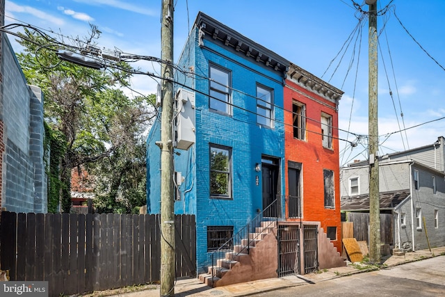 1406 Lemmon St, Baltimore, MD 21223 - view of front of house with a fenced front yard and brick siding