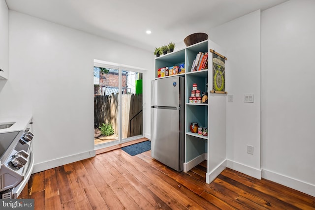 1406 Lemmon St, Baltimore, MD 21223 - kitchen with stainless steel appliances, hardwood / wood-style flooring, recessed lighting, and open shelves
