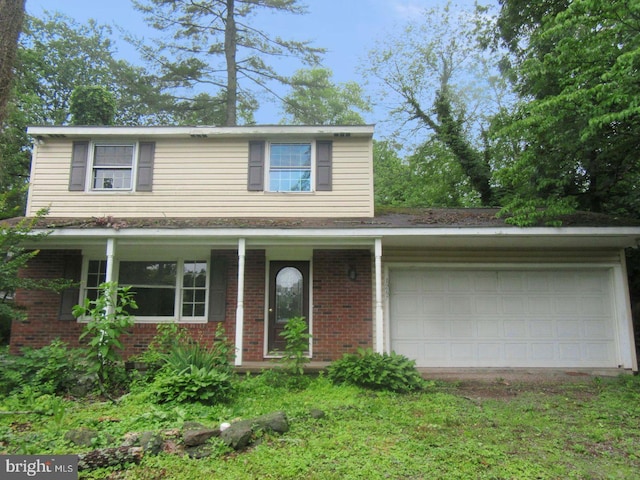 1267 Ringing Rocks Park, Pottstown, PA 19464 - traditional-style house with an attached garage, brick siding, and covered porch