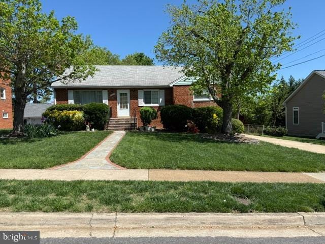 5915 Craig St, Springfield, VA 22150 - view of front of home with brick siding and a front yard