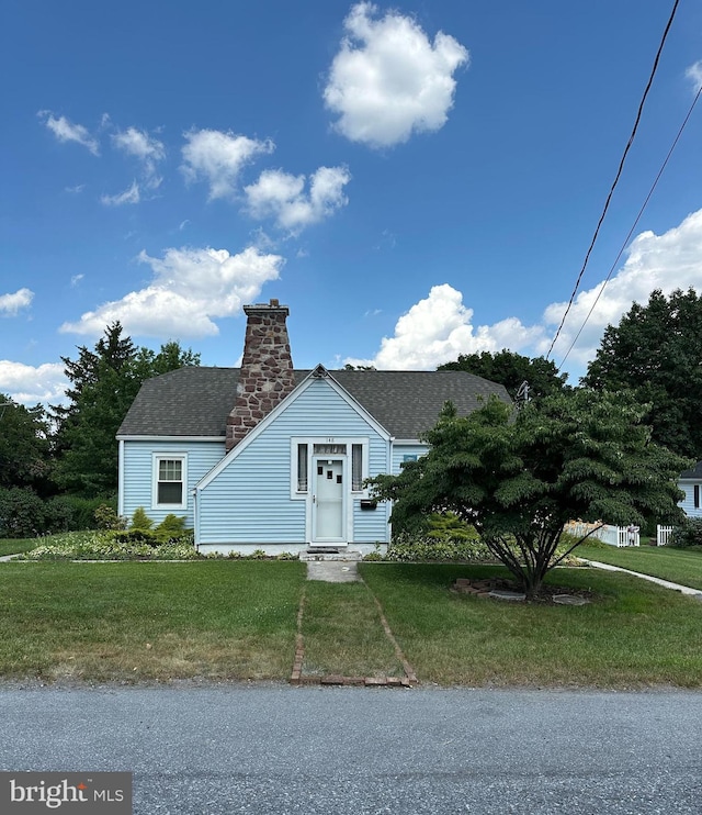 148 N Arlington Ave, Harrisburg, PA 17109 - view of front of property featuring a front yard, roof with shingles, and a chimney