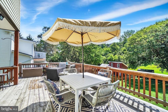 216 Hanover St, Glen Rock, PA 17327 - wooden terrace with outdoor dining area, an outdoor structure, and view of scattered trees
