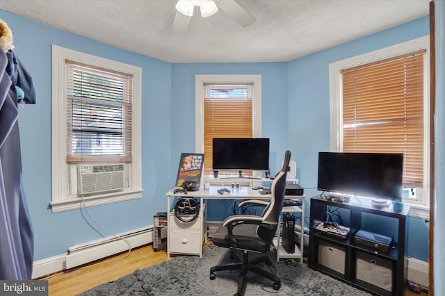 216 Hanover St, Glen Rock, PA 17327 - home office featuring plenty of natural light, wood finished floors, ceiling fan, cooling unit, and a textured ceiling