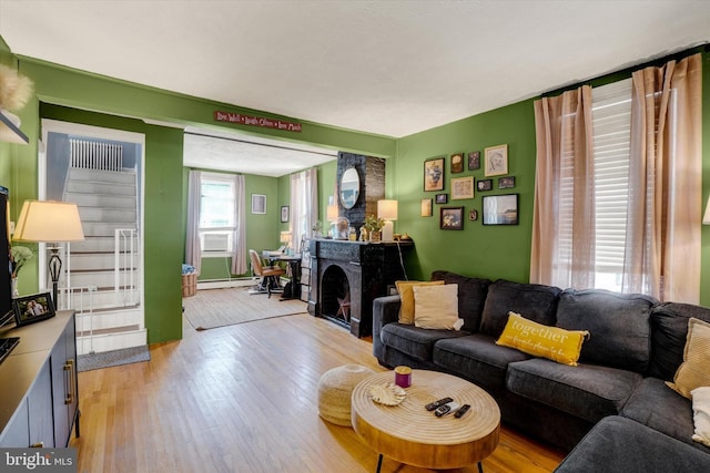 216 Hanover St, Glen Rock, PA 17327 - living room with light wood-style flooring, baseboard heating, and a fireplace