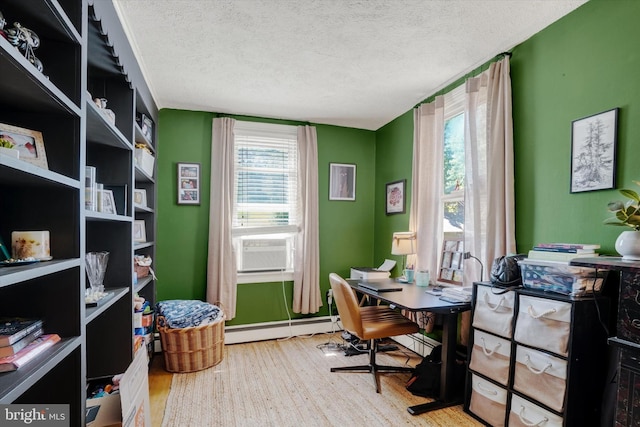 216 Hanover St, Glen Rock, PA 17327 - office area with a baseboard radiator, a textured ceiling, plenty of natural light, wood finished floors, and cooling unit