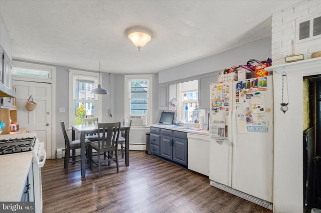 216 Hanover St, Glen Rock, PA 17327 - kitchen featuring white appliances, light countertops, dark wood-style floors, pendant lighting, and cooling unit