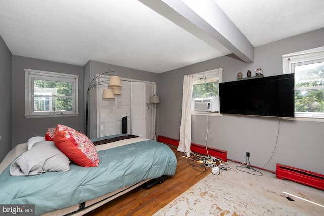 26 Worrell Rd, Tabernacle, NJ 08088 - bedroom with wood finished floors, multiple windows, cooling unit, beam ceiling, and a closet